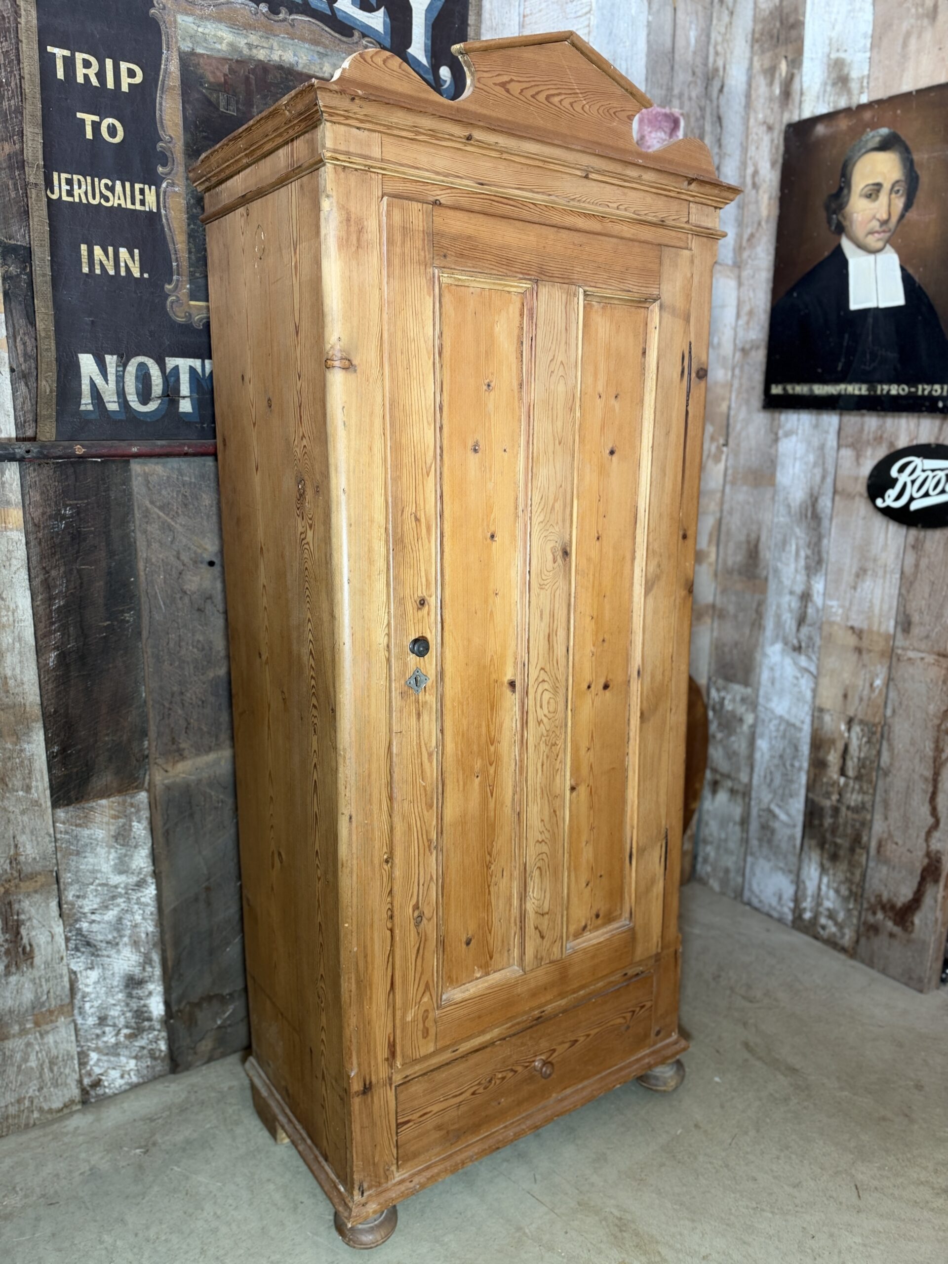 Antique French pine single armoire wardrobe circa 1880 with decorative shaped pediment.